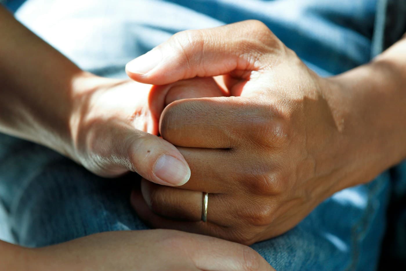 A professional caregiver talking with an older adult at home